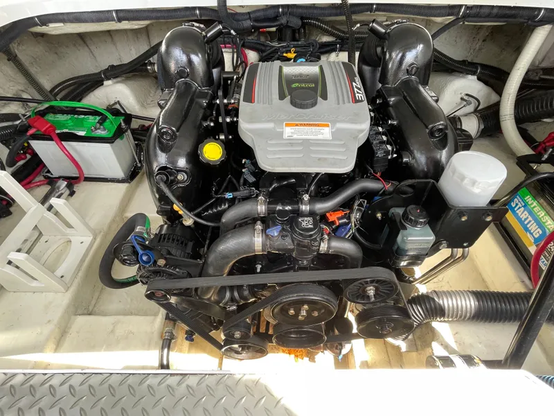 Slide: The Image of Engine compartment of a 2014 Formula 270 Bowrider boat, showcasing detailed components. - 49
