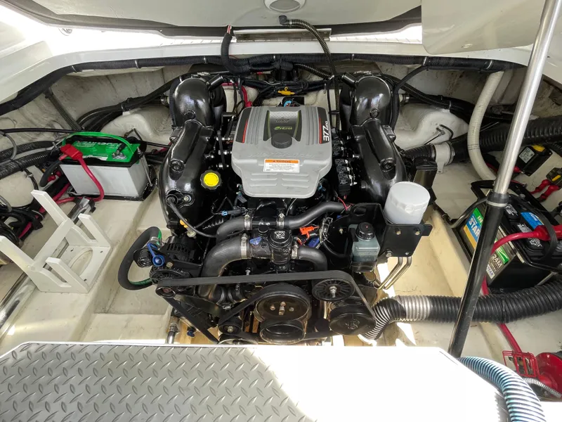 Slide: The Image of Engine compartment of a 2014 Formula 270 Bowrider boat, showcasing detailed mechanical components. - 50