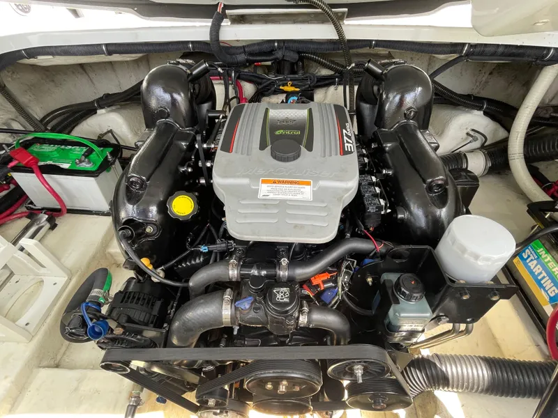 Slide: The Image of Engine compartment of a 2014 Formula 270 Bowrider boat, featuring a MerCruiser engine. - 51