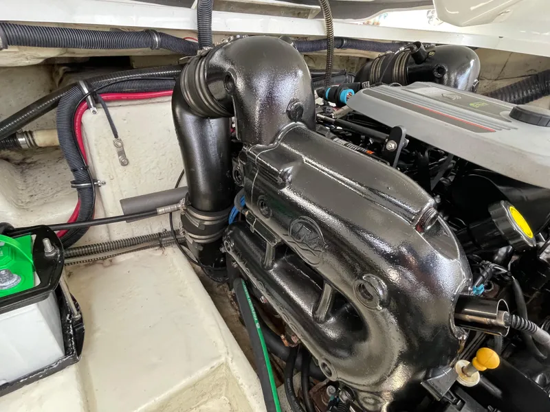 Slide: The Image of Engine compartment of a 2014 Formula 270 Bowrider boat, showcasing detailed components. - 52