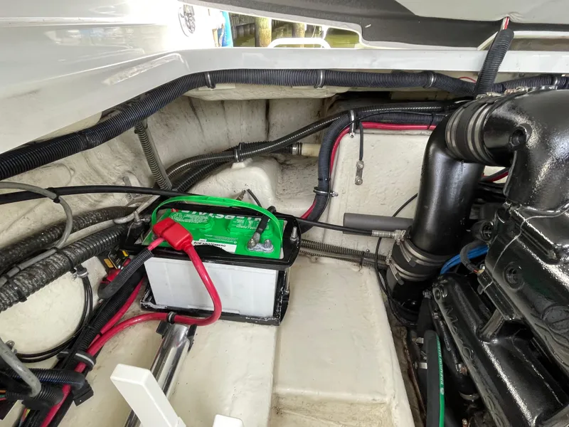Slide: The Image of Engine compartment of a 2014 Formula 270 Bowrider with visible battery and wiring. - 54