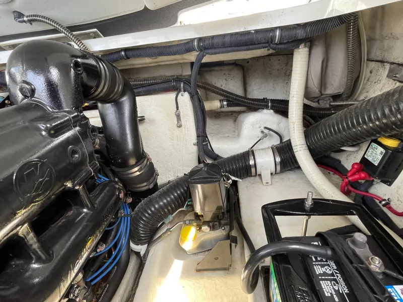 Slide: The Image of Engine compartment of a 2014 Formula 270 Bowrider with visible components and wiring. - 55