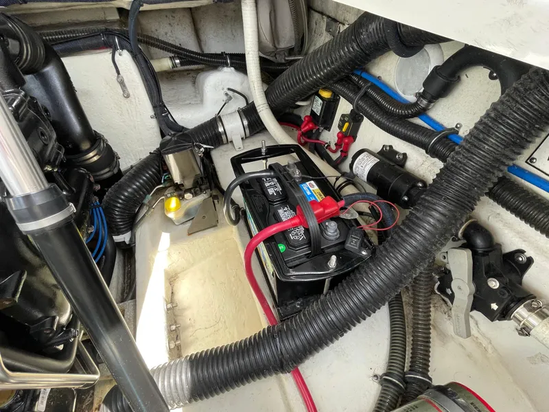 Slide: The Image of Engine compartment of a 2014 Formula 270 Bowrider with battery and wiring. - 57