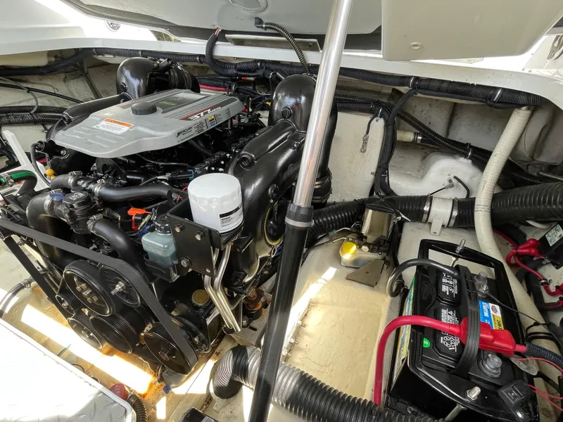 Slide: The Image of Engine compartment of a 2014 Formula 270 Bowrider boat, featuring a Mercury engine. - 58