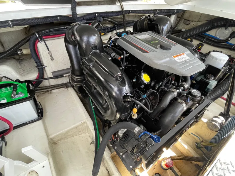 Slide: The Image of Engine compartment of a 2014 Formula 270 Bowrider boat, showcasing detailed components. - 59