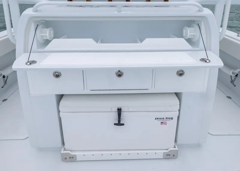 Slide: The Image of 2026 Invincible 40 Catamaran fishing station with storage drawers and cooler. - 22