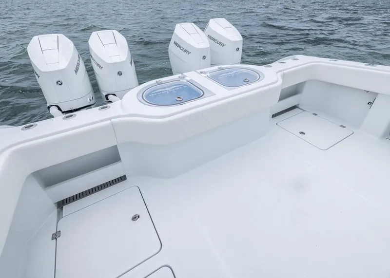 Slide: The Image of 2026 Invincible 40 Catamaran with four Mercury outboard engines on open water. - 26