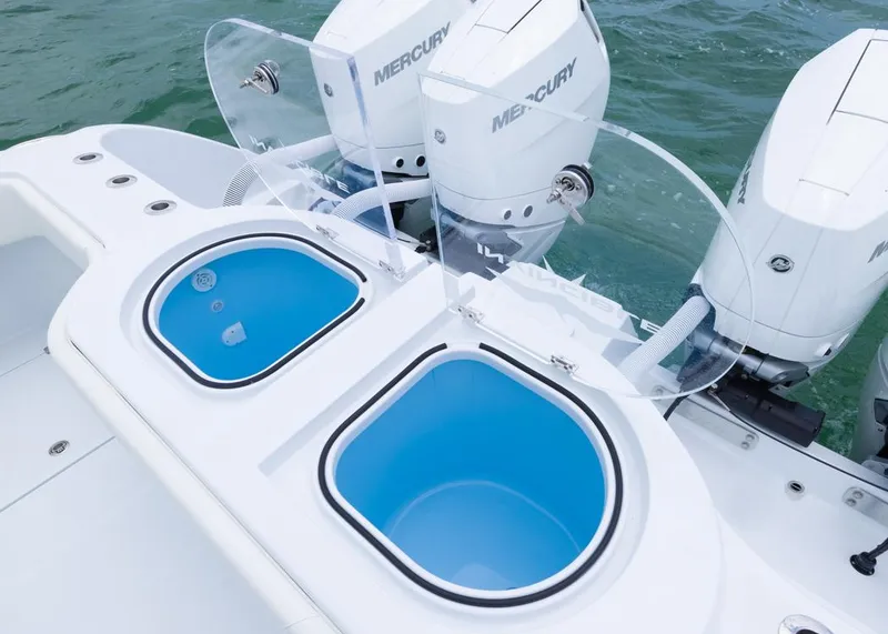 Slide: The Image of 2026 Invincible 40 Catamaran with dual Mercury engines and blue livewells on deck. - 27