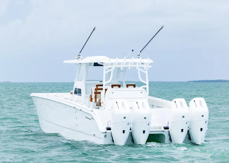 Slide: The Image of 2026 Invincible 40 Catamaran with quad engines on open sea. - 3