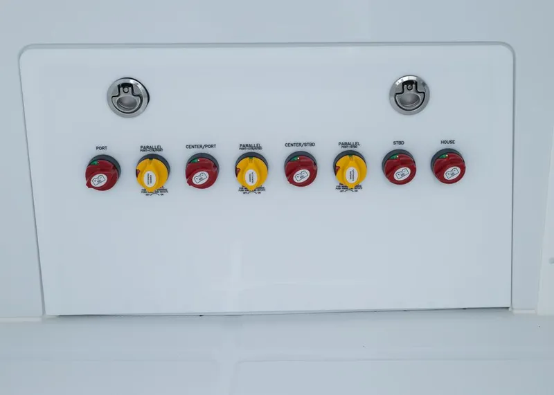 Slide: The Image of Control panel of 2026 Invincible 40 Catamaran with labeled switches and locks. - 30