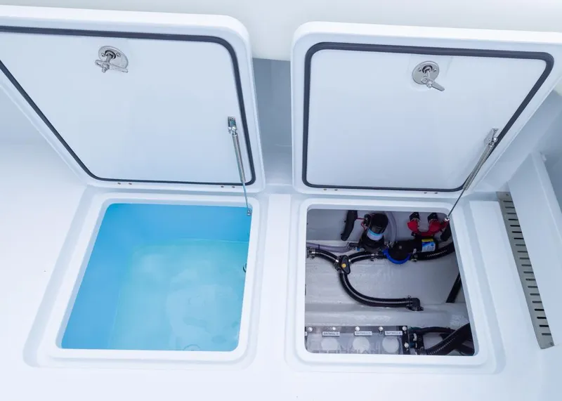 Slide: The Image of Open compartments on 2026 Invincible 40 Catamaran, showing storage and mechanical systems. - 35