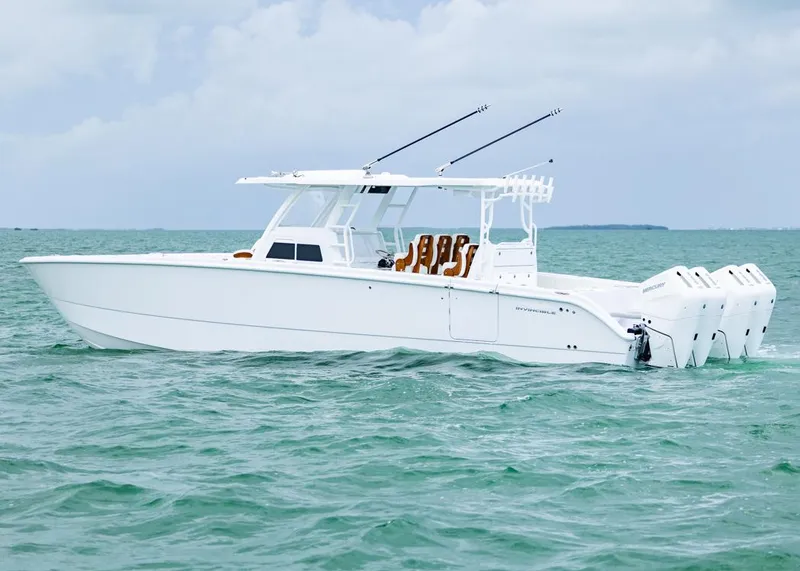 Slide: The Image of 2026 Invincible 40 Catamaran on open water, featuring sleek design and powerful engines. - 36