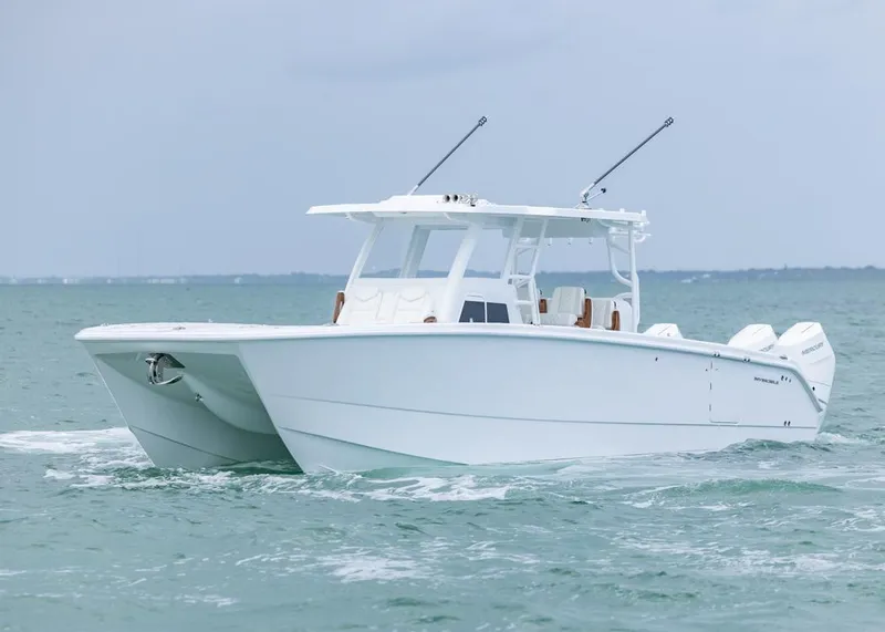 Slide: The Image of 2026 Invincible 40 Catamaran cruising on open water. - 39