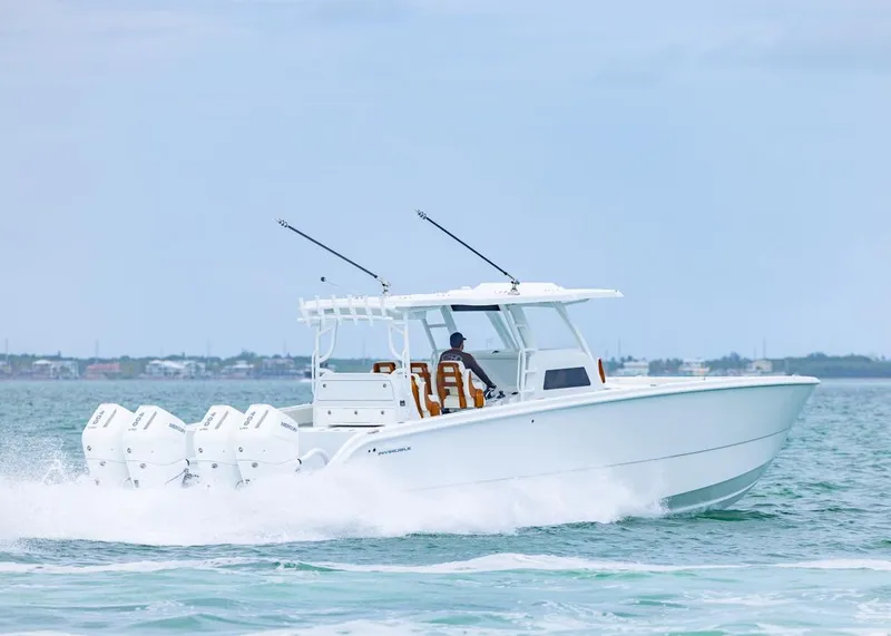 Slide: The Image of Invincible 40 Catamaran 2026 cruising on open water with four engines. - 42