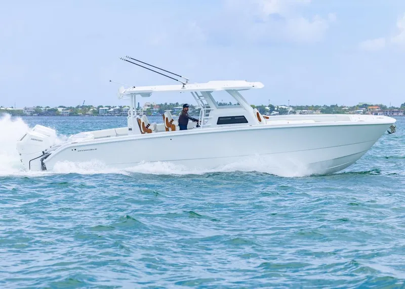 Slide: The Image of 2026 Invincible 40 Catamaran cruising on open water, showcasing sleek design and performance. - 46