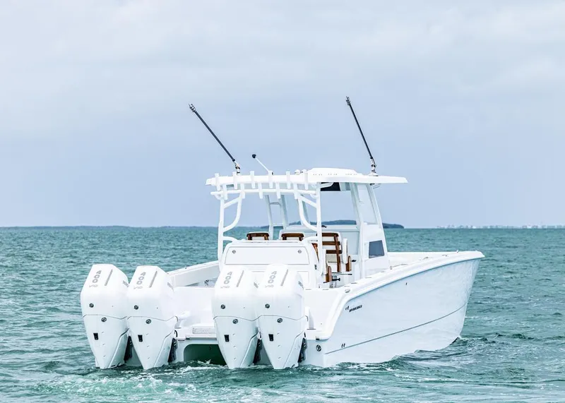 Slide: The Image of 2026 Invincible 40 Catamaran with quad engines cruising on open water. - 5