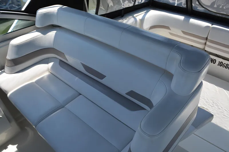 Slide: The Image of 1998 Formula 31 PC boat interior with white leather seating and modern design. - 16