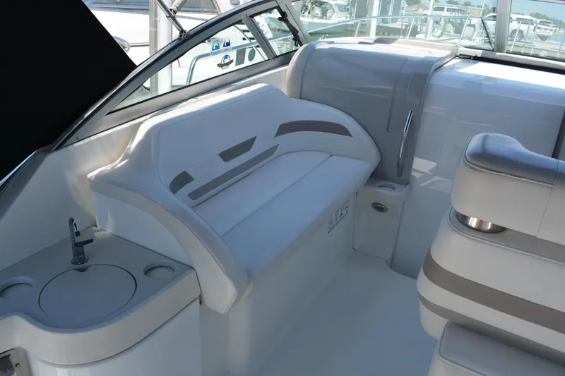 Slide: The Image of 1998 Formula 31 PC boat interior with white seating and compact sink. - 17