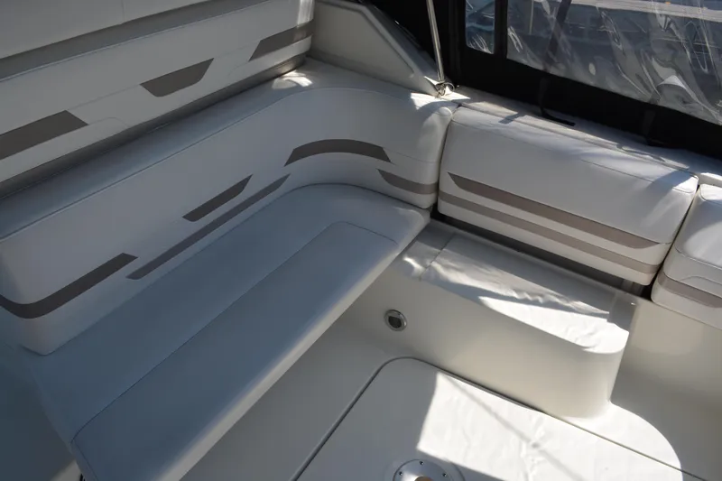 Slide: The Image of 1998 Formula 31 PC boat interior with white cushioned seating and modern design. - 18