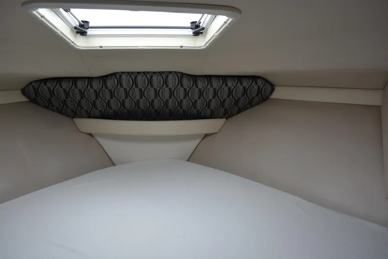 Slide: The Image of 1998 Formula 31 PC cabin interior with skylight and patterned headboard. - 21