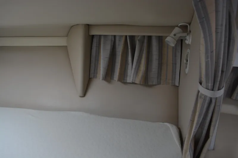Slide: The Image of 1998 Formula 31 PC cabin interior with curtains and reading light. - 22