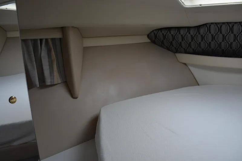 Slide: The Image of 1998 Formula 31 PC cabin interior with beige upholstery and patterned accents. - 23