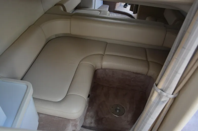 Slide: The Image of 1998 Formula 31 PC interior with beige leather seating and carpeted floor. - 26