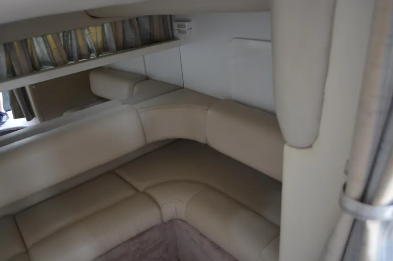 Slide: The Image of Interior of 1998 Formula 31 PC boat with beige leather seating and curtains. - 27
