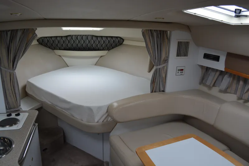 Slide: The Image of 1998 Formula 31 PC cabin interior with bed, seating, and kitchenette. - 30
