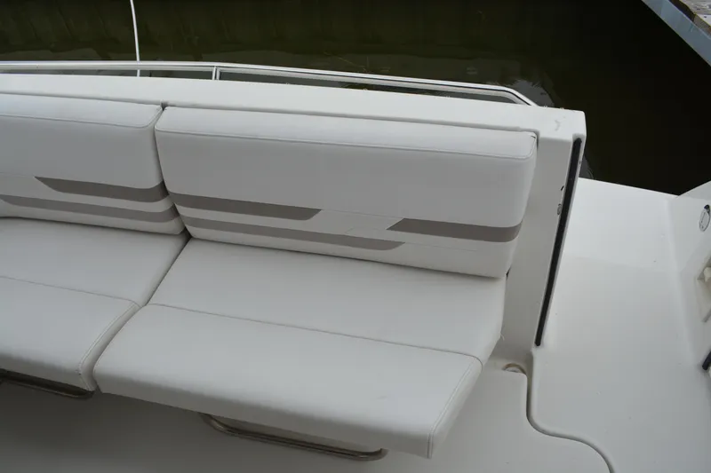Slide: The Image of White seating on a 1998 Formula 31 PC boat, featuring sleek design and comfortable cushions. - 38