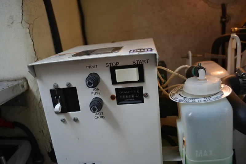 Slide: The Image of Control panel of a 1998 Formula 31 PC boat with start button and fuse. - 40