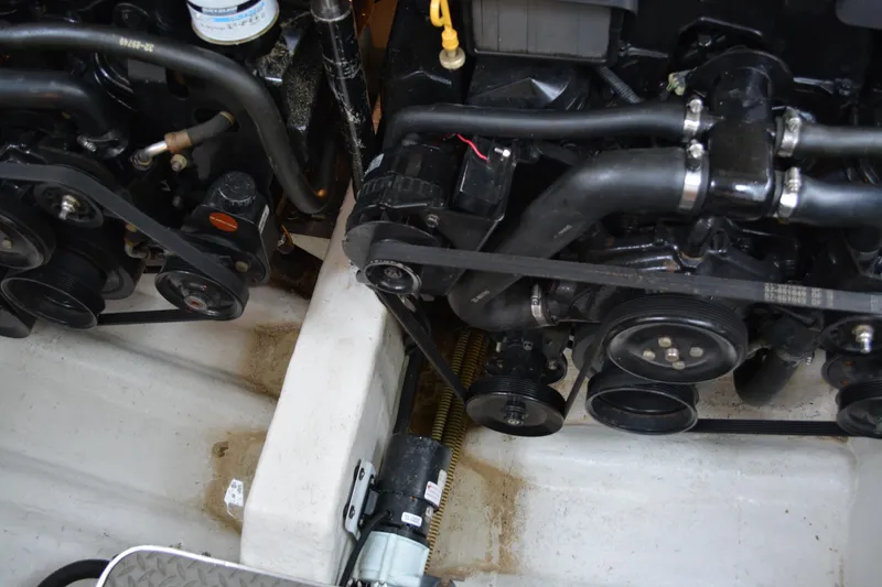 Slide: The Image of Engine compartment of a 1998 Formula 31 PC boat, showing belts and hoses. - 44