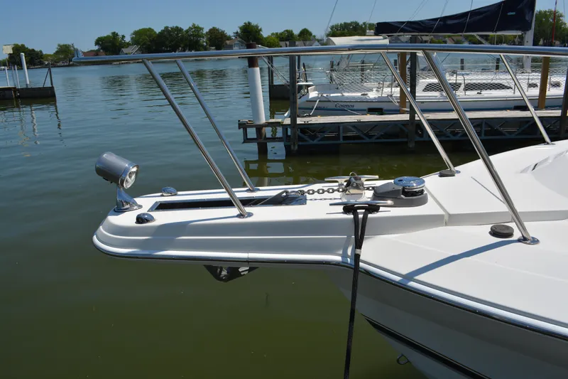 Slide: The Image of 1998 Formula 31 PC boat bow with railing and anchor chain at marina. - 7