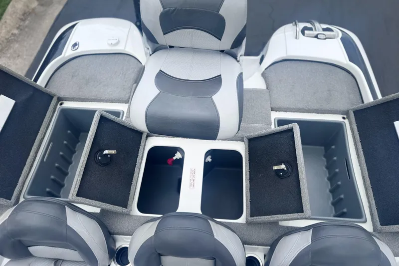 Slide: The Image of 2015 Nitro Z6 SC boat interior with open storage compartments and seating. - 12