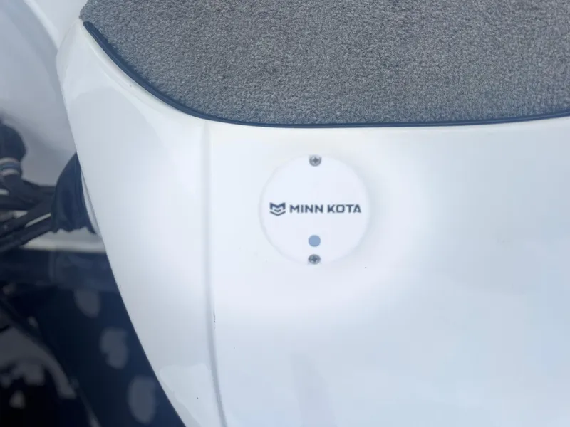 Slide: The Image of Minn Kota component on 2015 Nitro Z6 SC boat, featuring gray carpeted surface. - 14