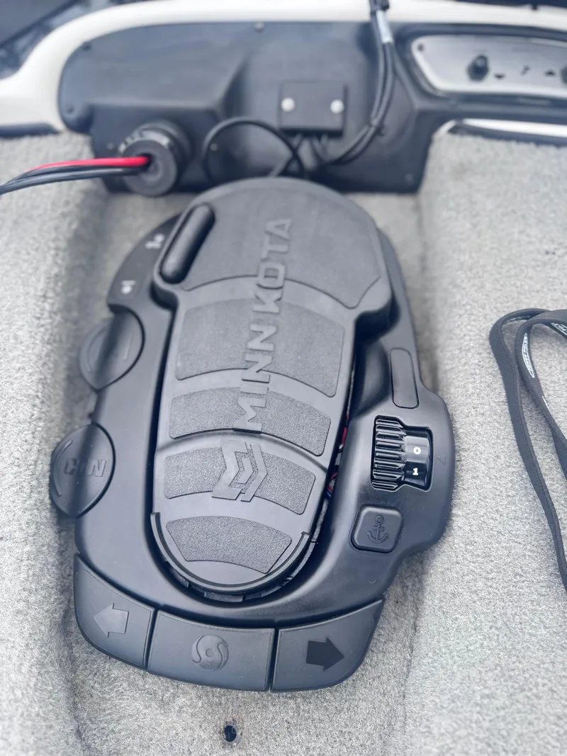 Slide: The Image of Minn Kota foot pedal on 2015 Nitro Z6 SC boat, featuring control buttons and textured surface. - 5