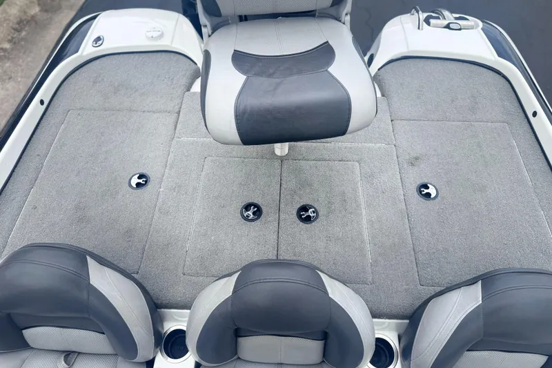 Slide: The Image of 2015 Nitro Z6 SC boat interior with gray seating and storage compartments. - 9