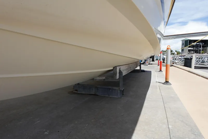Slide: The Image of 2005 Hydra-Sports Vector 3300 CC boat hull on dry dock, side view. - 13