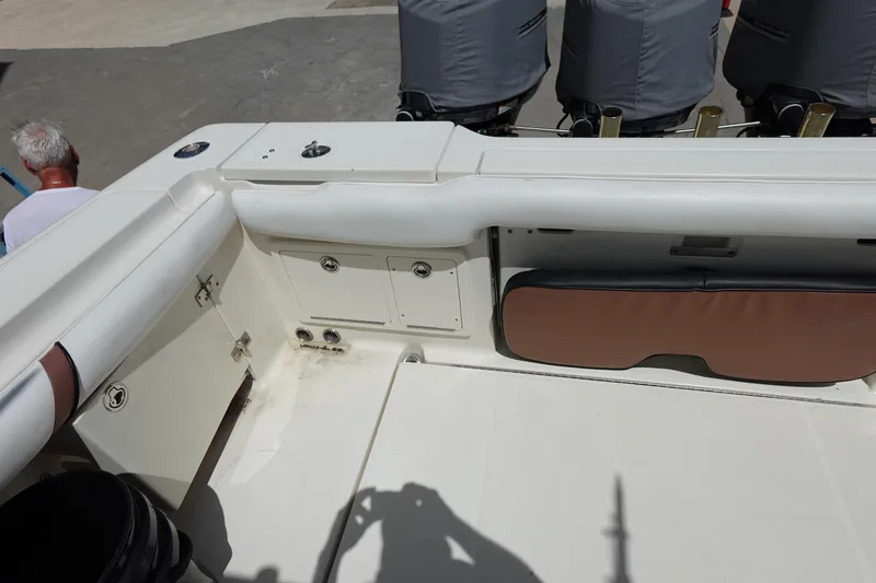 Slide: The Image of 2005 Hydra-Sports Vector 3300 CC boat interior with storage compartments and covered engines. - 15