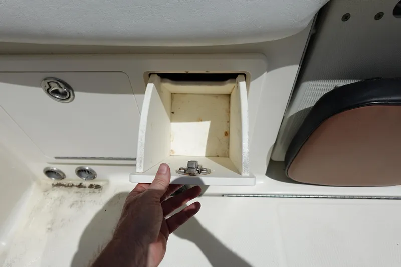 Slide: The Image of Open storage compartment on a 2005 Hydra-Sports Vector 3300 CC boat. - 16