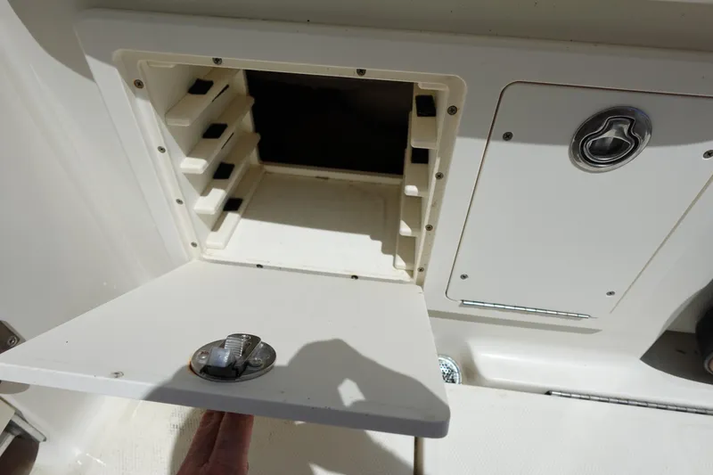 Slide: The Image of 2005 Hydra-Sports Vector 3300 CC storage compartment with open hatch and latch detail. - 17