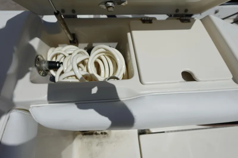 Slide: The Image of Storage compartment with coiled hose on 2005 Hydra-Sports Vector 3300 CC boat. - 20