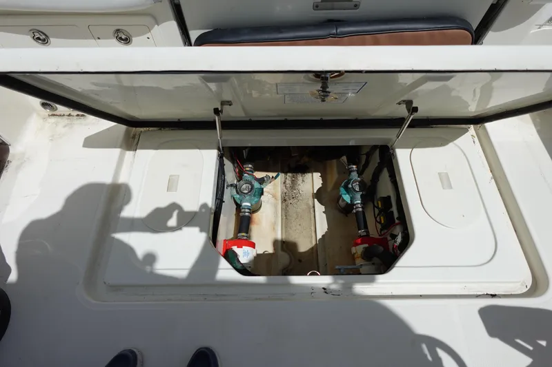 Slide: The Image of Open hatch of a 2005 Hydra-Sports Vector 3300 CC boat, revealing internal components. - 21