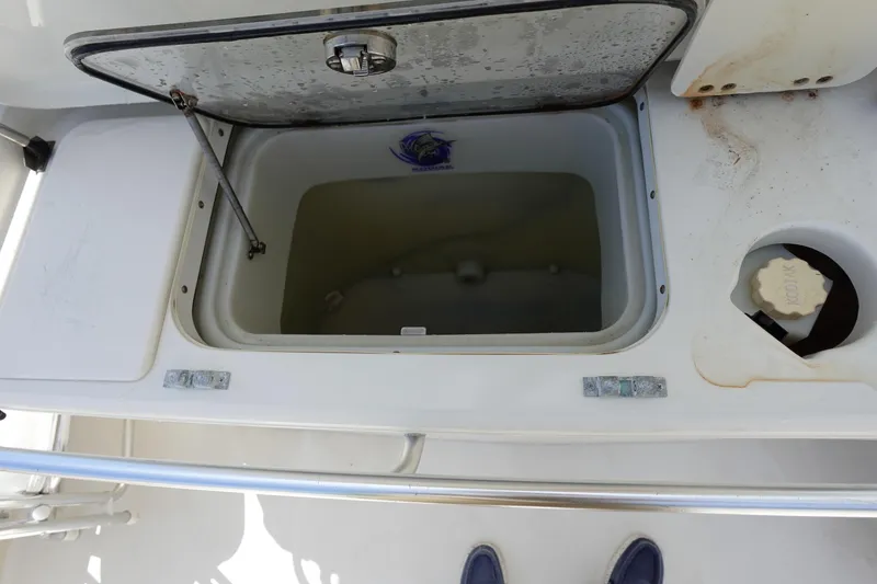 Slide: The Image of Open storage compartment on 2005 Hydra-Sports Vector 3300 CC boat deck. - 26