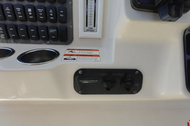 Slide: The Image of 2005 Hydra-Sports Vector 3300 CC dashboard with switches and warning labels. - 29