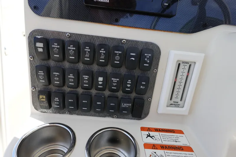 Slide: The Image of Control panel of a 2005 Hydra-Sports Vector 3300 CC boat with switches and warnings. - 30