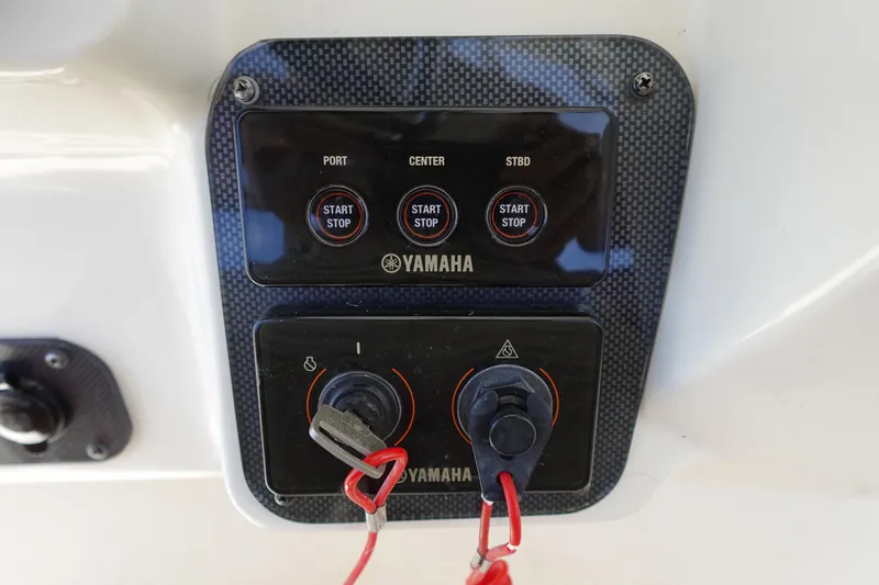 Slide: The Image of Control panel of a 2005 Hydra-Sports Vector 3300 CC with Yamaha start-stop buttons. - 35