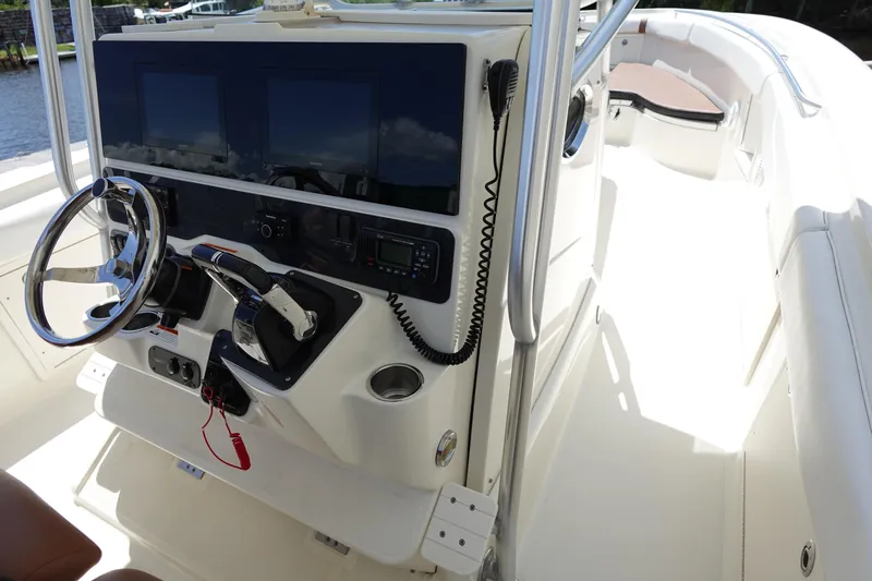 Slide: The Image of 2005 Hydra-Sports Vector 3300 CC boat cockpit with steering wheel and control panel. - 36