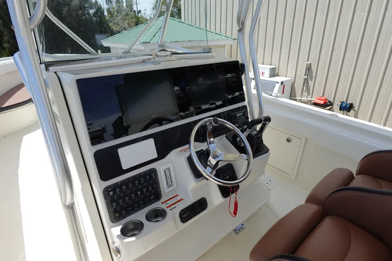 Slide: The Image of 2005 Hydra-Sports Vector 3300 CC boat console with steering wheel and controls. - 4