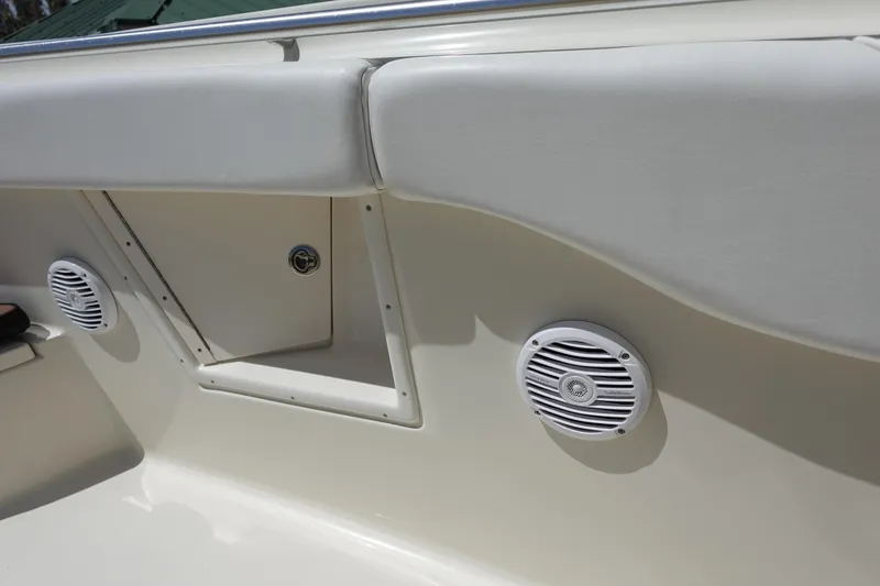 Slide: The Image of 2005 Hydra-Sports Vector 3300 CC boat interior with speakers and storage compartment. - 41